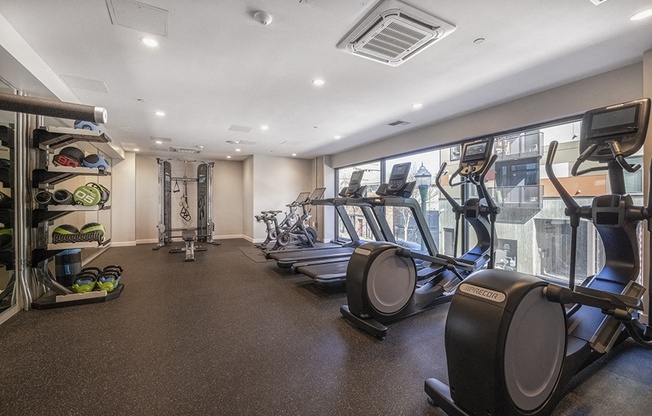 Gym with cardio equipment l Rasa Apartments in Oakland CA