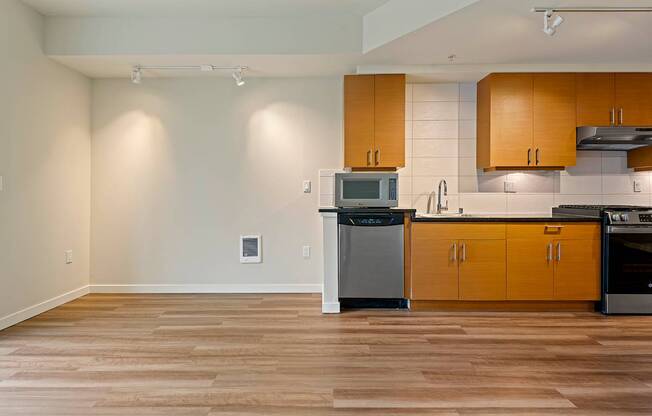 A kitchen with wooden cabinets and a dishwasher.