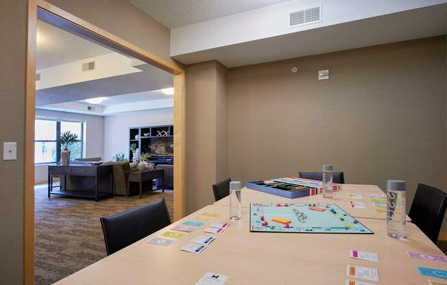 A conference room with a long table and a board game on it.