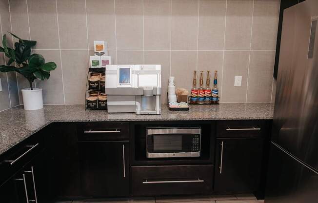 Gourmet coffee station with coffee and tea options and syrups.