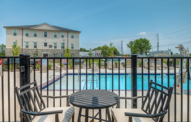 Patio seating next to pool