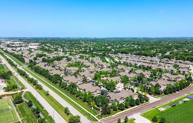 A suburban neighborhood with houses and a road.