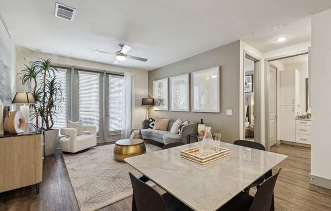 an open living room and dining room with a white table at LynnCora, Grand Prairie, TX, 75052