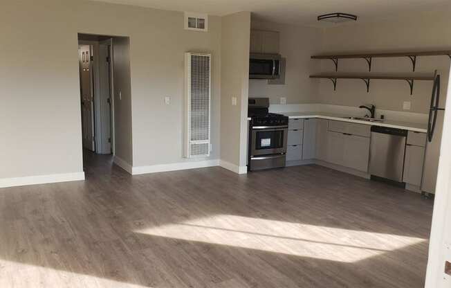 Living Room Space Near Kitchen and Dining Are at Wilson Apartments in Glendale, CA