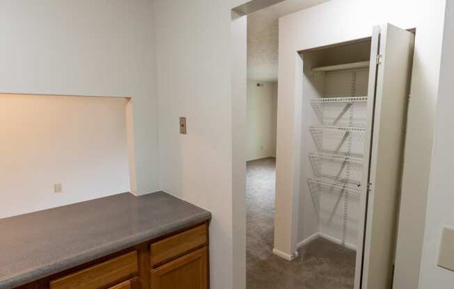 This is a photo of a hall closet in the 902 square foot, 2 bedroom, 1 and a half bath apartment at Blue Grass Manor Apartments in Erlanger, KY.