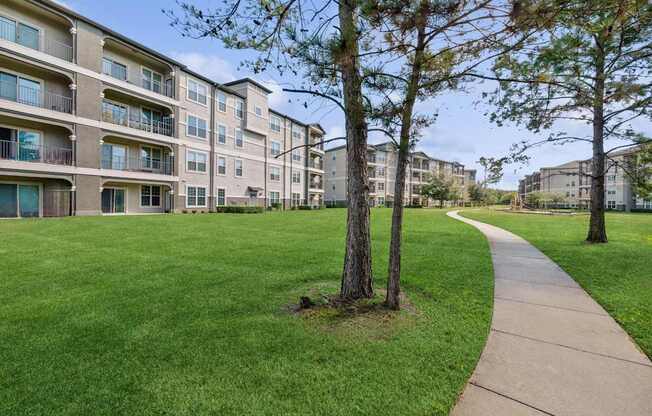 exterior view of Park at Magnolia apartments 30000 FM2978, Magnolia, TX  77354