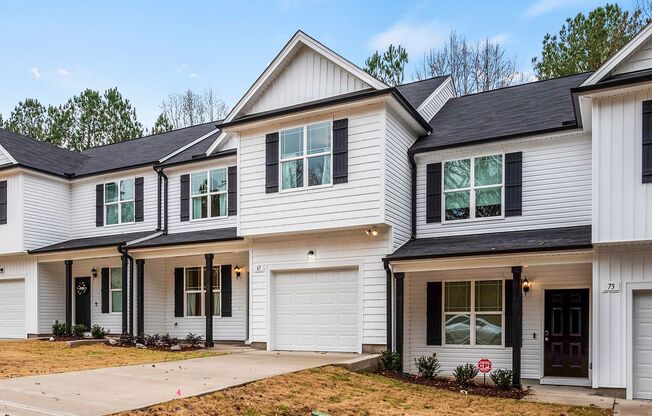 MOVE IN READY! BRAND NEW 4 bedroom 2.5 bathroom townhome with GARAGE and WOODED VIEW!