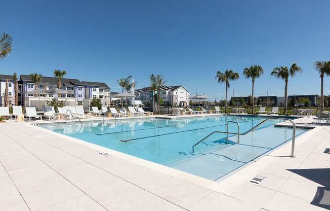 a large swimming pool with palm trees in at Lake Nona Concorde