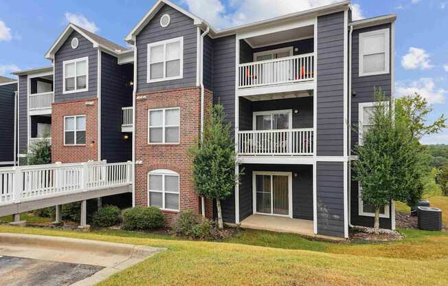Pet-Friendly Rentals in Little Rock, AR – Capitol Hill – Apartment building with grey and red brick exterior.
