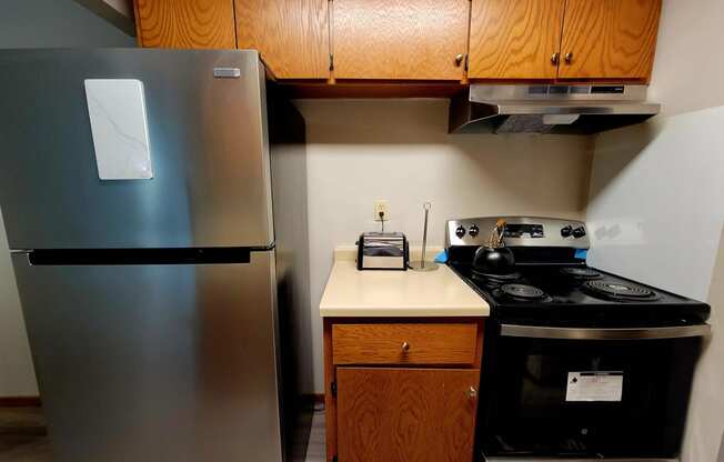 a kitchen with a stove and a refrigerator
