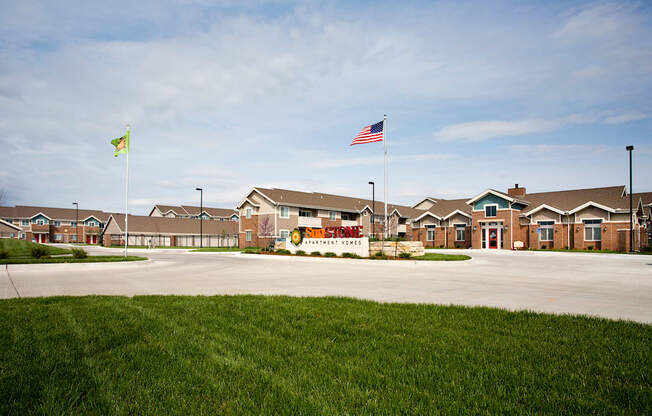 A building with a sign that says "Aerate Home" is in front of some houses.