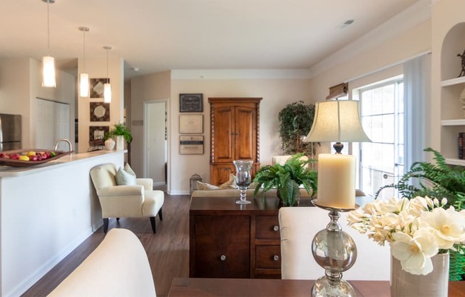 This is a photo of the living room from the dining area in the 2 bedroom, 2 bath Islander floor plan at Nantucket Apartments in Loveland, OH.