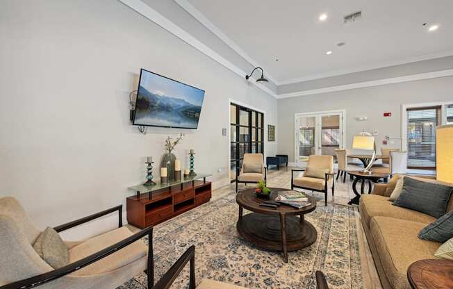 a view of a living room with a geometric design on the wall