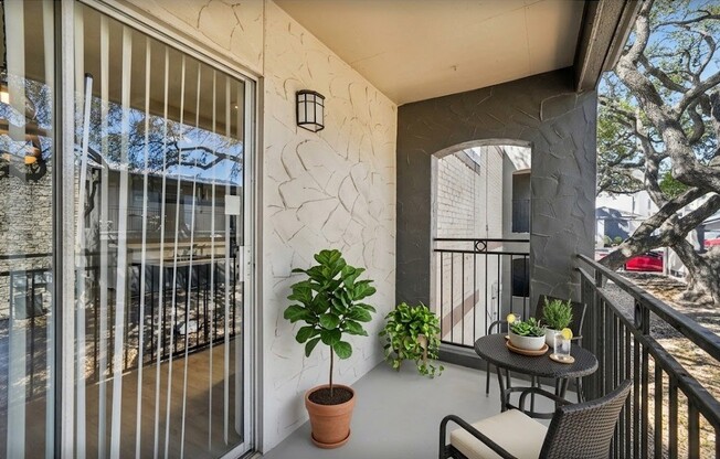 Embrace serene living at The Riley Apartments with this inviting balcony, perfect for morning relaxation or evening gatherings. Enjoy urban comforts while surrounded by nature. Ready to make this space your own? Schedule a tour today!
