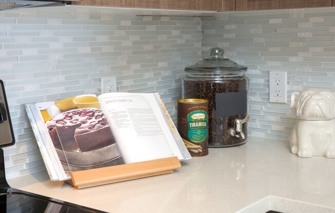Close up of a recipe book sitting on a kitchen counter in a rental community in Miami.