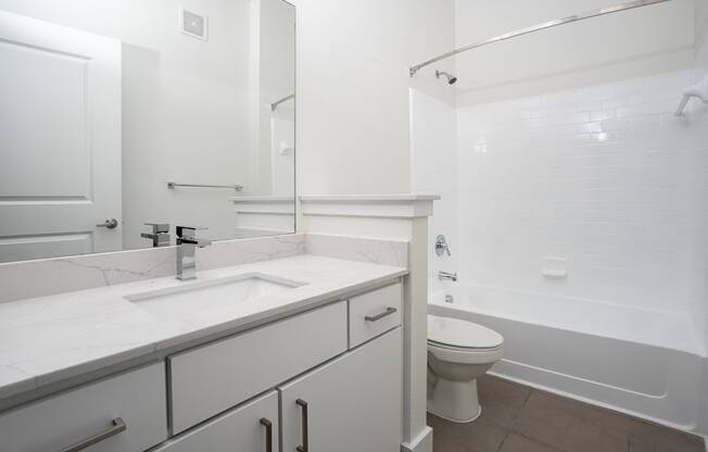 a bathroom with a sink toilet and bathtub