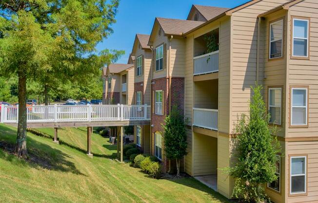 Outside photo of Capitol Hill apartments with bridge leading to complex