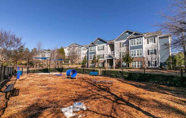 the preserve at ballantyne commons dog park with playground and apartment buildings