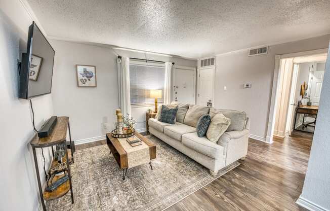 a living room with a couch and a coffee table