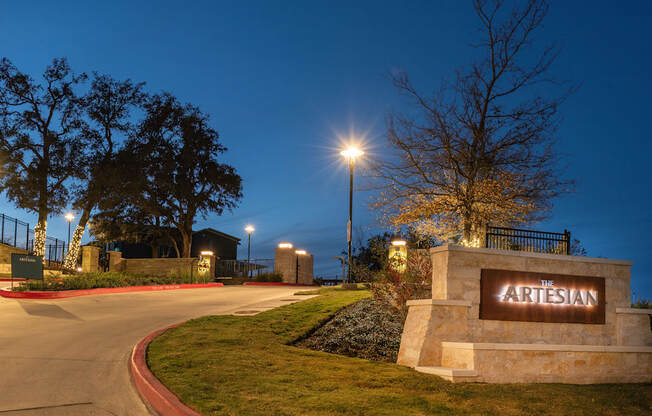 the entrance to the arrisan park at night