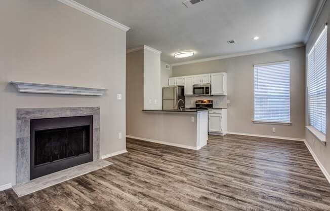 Apartments in Plano, TX - Modern Living Room with Hardwood Flooring and Access to Kitchen