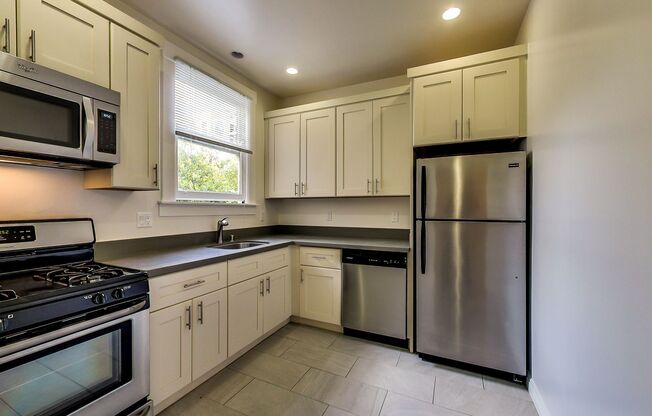 TOP FLOOR! LARGE CLOSET! On-Site LAUNDRY!  DISHWASHER! HARDWOOD!