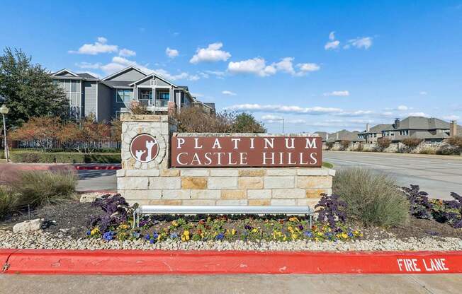 Platinum Castle Hills sign in front of a building.