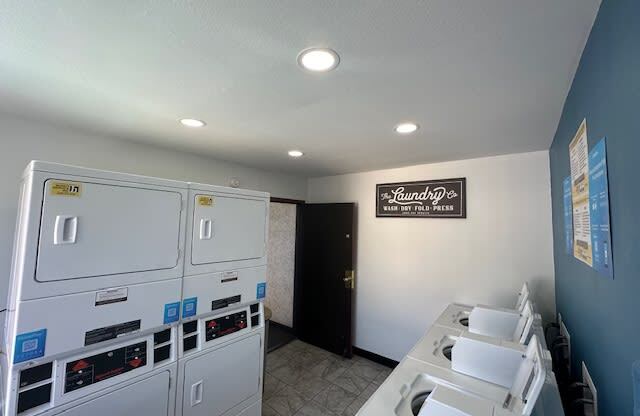 a kitchen with white appliances and a counter top