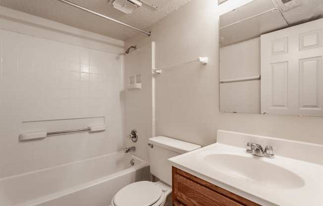 a bathroom with a sink toilet and bathtub