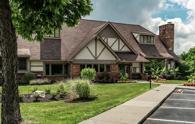 A house with a brick chimney and a large front yard