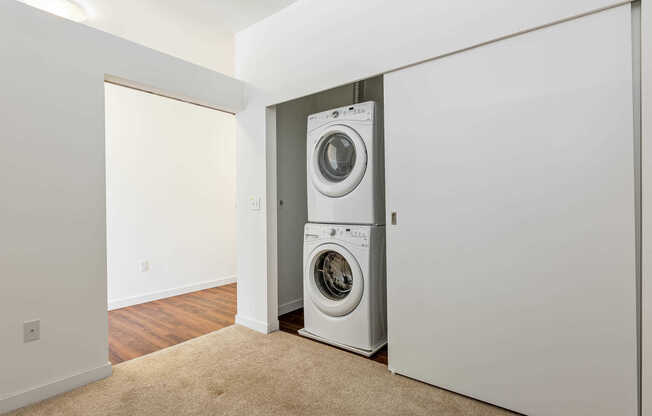 Bedroom with In-Home Washer and Dryer