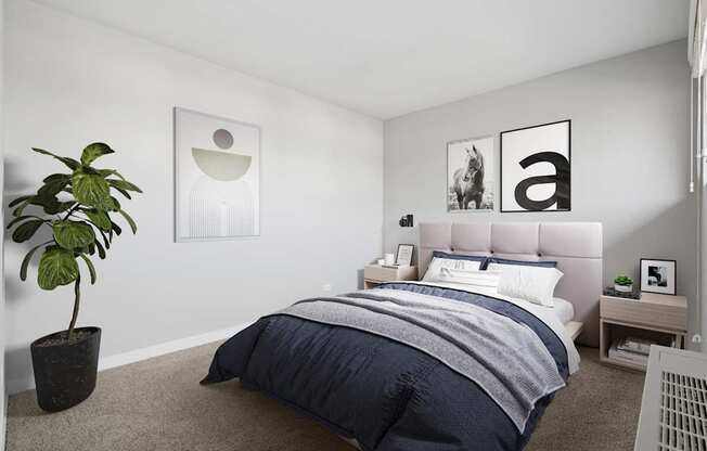 A bedroom with a bed, nightstand, and a plant.