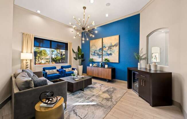 Leasing waiting area with couches and refreshments at The Fairways by Picerne Apartments, Nevada, 89141