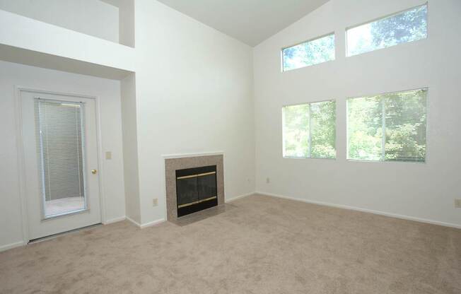 Autumn Oaks vacant 3x2 living room and fireplace