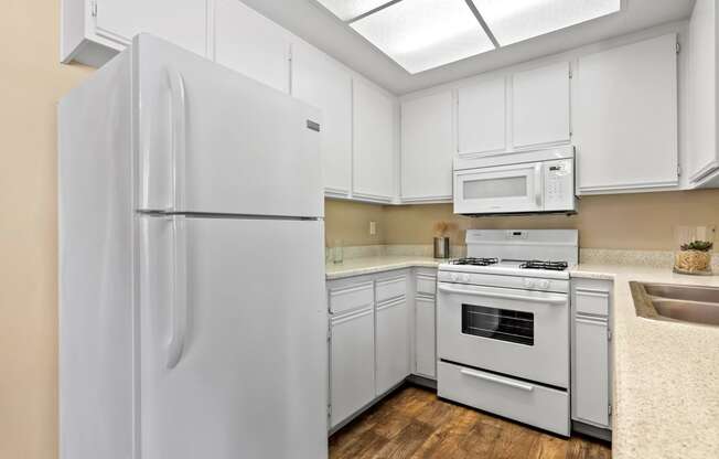 All-white kitchen at River Oaks in Oceanside, CA