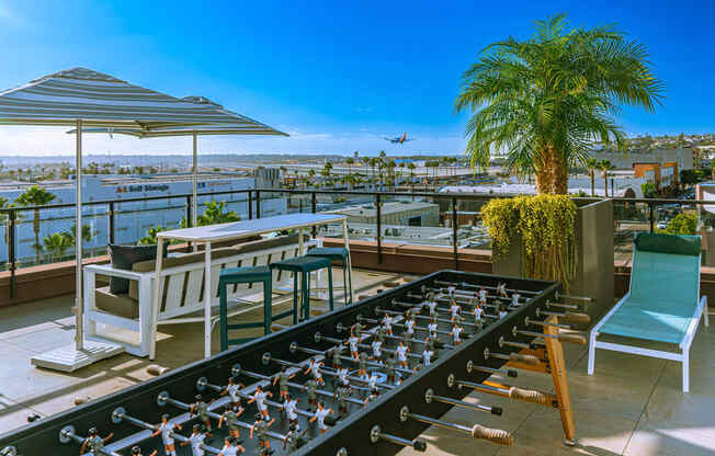 Foosball on the rooftop patio at AV8 Apartments in San Diego, CA