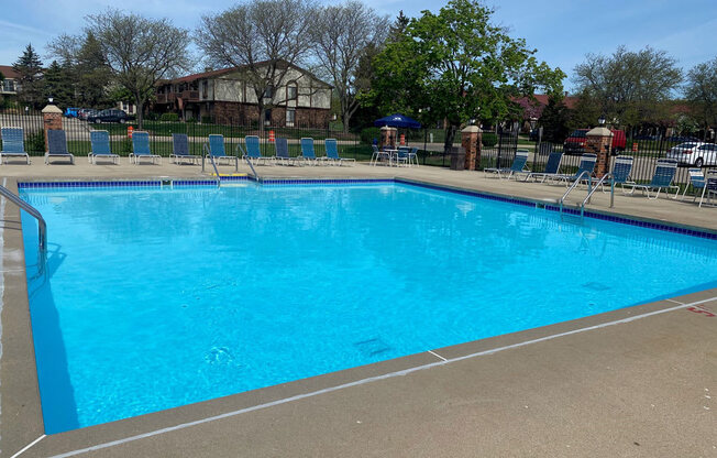 Outdoor Pool with Large Sundeck at Wood Creek Apartments, Kenosha, WI