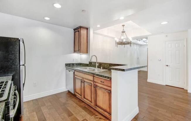 a kitchen with a counter top and a refrigerator