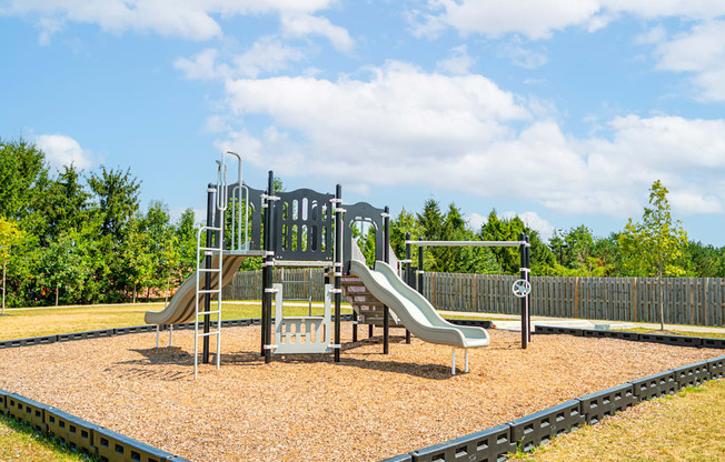 a playground with slides on a sunny day