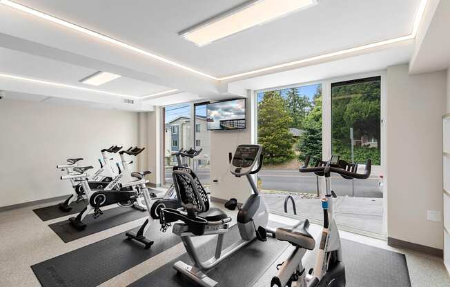 Resident Fitness Facilities filled with exercise equipment at Arabella Apartment Homes, Shoreline, 98155