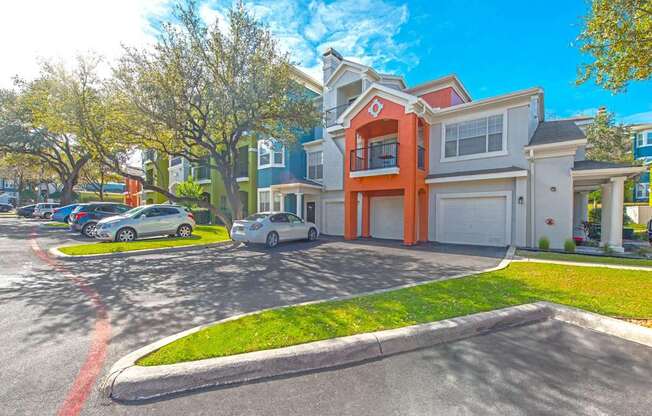 A row of houses with cars parked in front at Reserve at Canyon Creek, San Antonio
