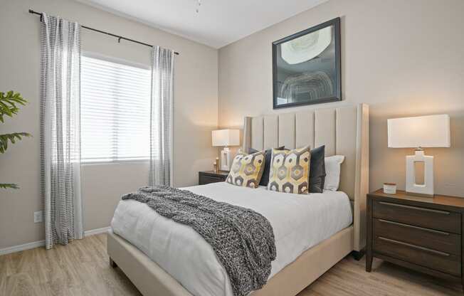 an overview of a bedroom with a bed and a window