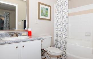 a room with a sink and a shower