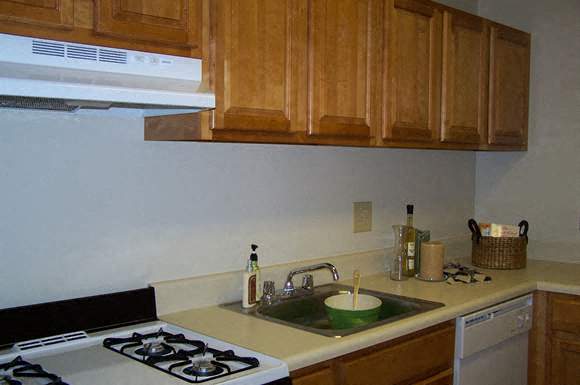 a kitchen with a sink and a stove