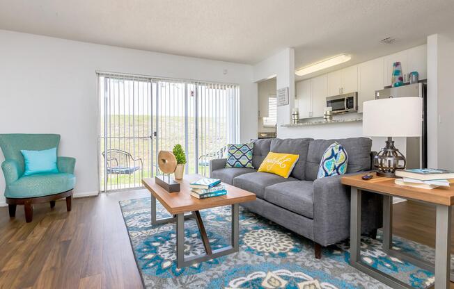 a living room filled with furniture and a table