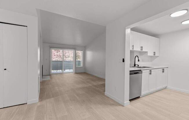 The Marina at Martha Lake Apartments in Bothell, WA Kitchen and View into Living Room