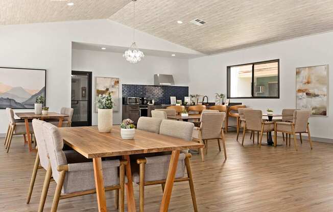 A modern dining room with a wooden table and chairs.