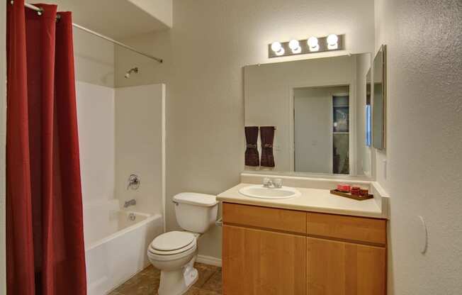 a bathroom with a toilet sink and bathtub