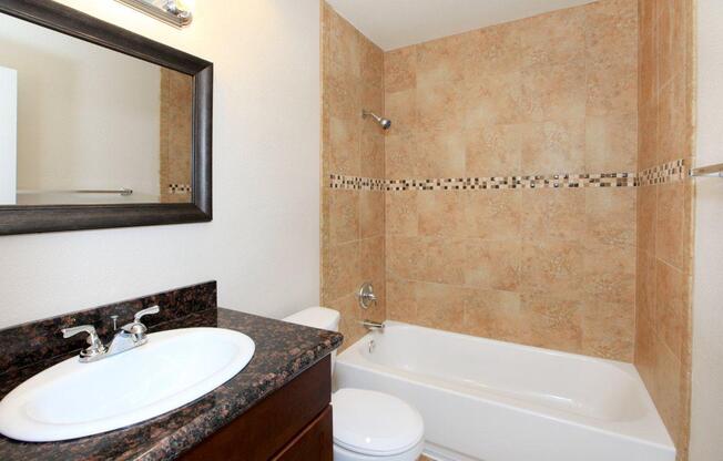 a double sink and large mirror