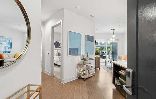 A modern entry way with wood floors at Knox Heights Apartments in Dallas, TX